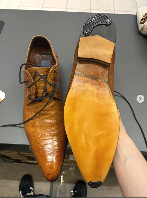 Python leather dress shoe after Heel Quik resoling — fresh leather sole and new heel cap
